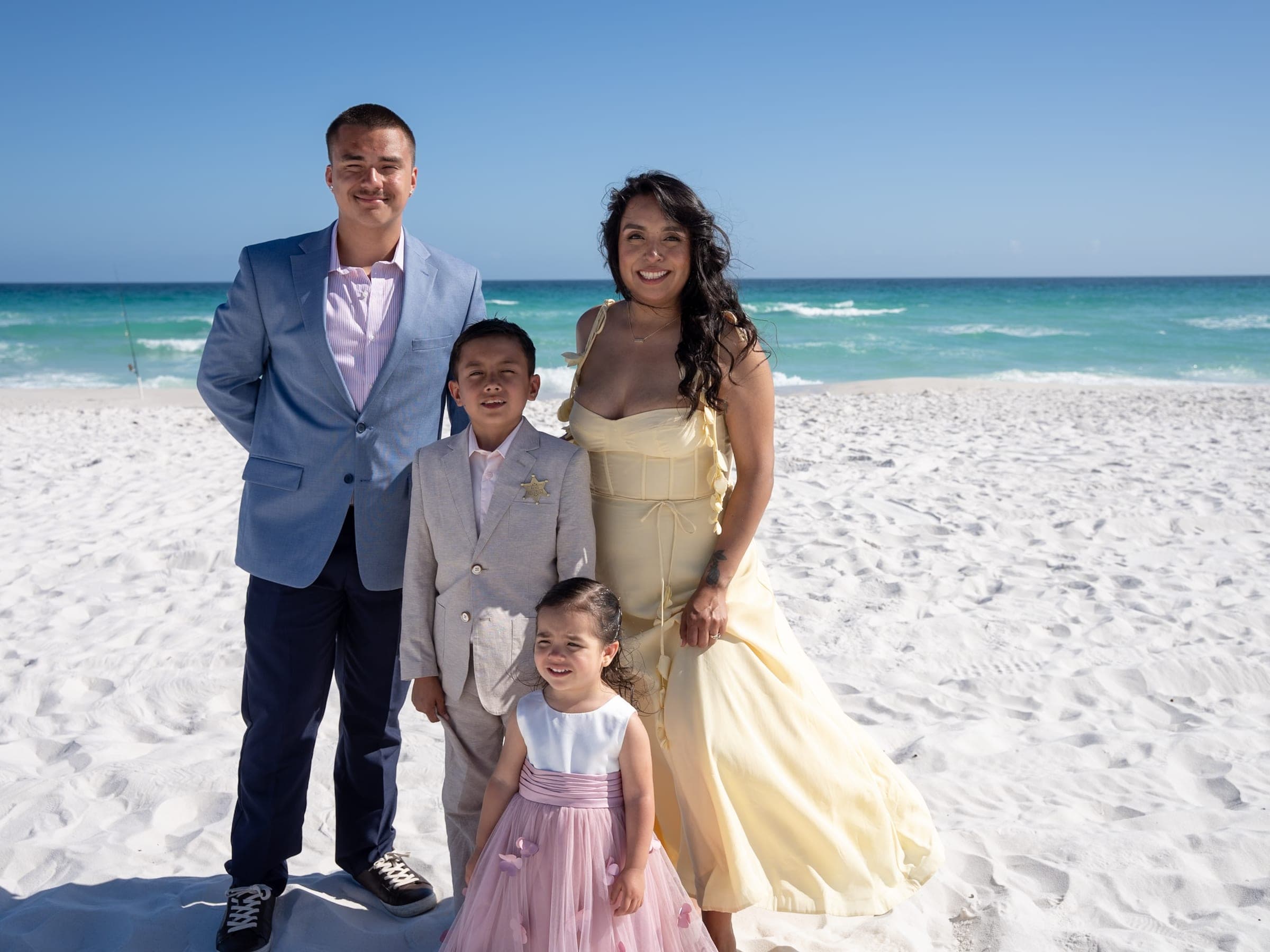 Michael Fisher with his family on the beach