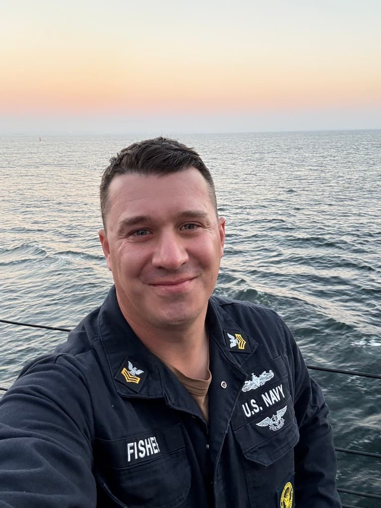 Michael Fisher in his Navy uniform at sea